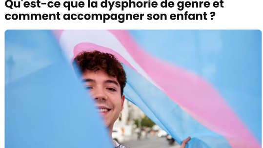 A teenage with a transgender flag
